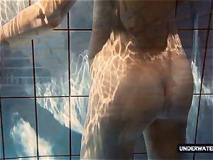 steamy giant titted nubile Lera swimming in the pool