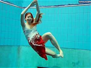 super-hot grind redhead swimming in the pool